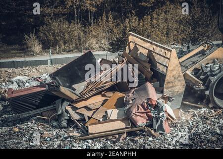 compactor at a landfill processing municipal waste Stock Photo