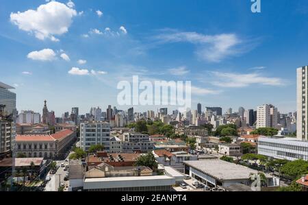 Beautiful view of São Paulo city skyline, avenues, houses and downtown business buildings in the background on sunny summer day with blue sky. Brazil. Stock Photo