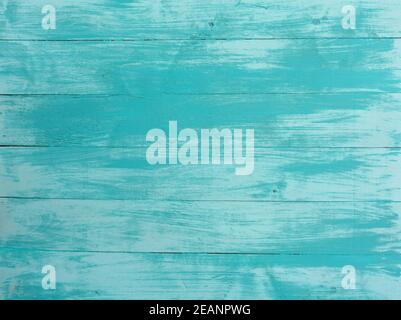Old vintage turquoise bright color with vertical boards. Grunge wooden background. Stylish shabby background with place for text in prince style. Stock Photo