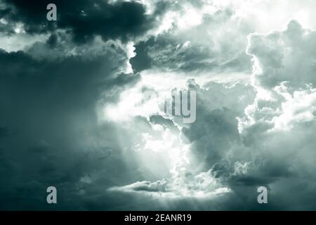 Gray and white fluffy clouds. Cloudy sky. White and gray texture background for sad, death, hopeless, and despair concept. Moody sky. Cloudscape. Dark dramatic sky. Background for dead and gloomy. Stock Photo