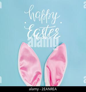 Decorative pink bunny ears on blue background Stock Photo