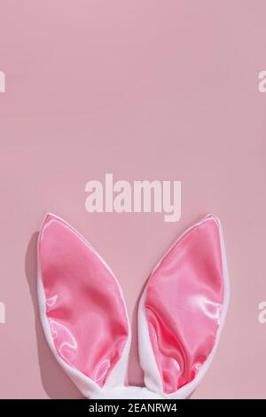 Decorative bunny ears on pink background. Stock Photo