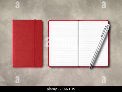 Dark red closed and open lined notebooks with a pen on concrete background Stock Photo