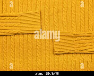 Background texture of yellow knitted wool fabric Stock Photo