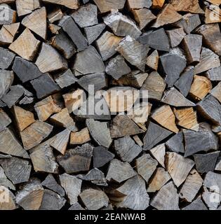Stack pile of firewood oak wooden logs Stock Photo