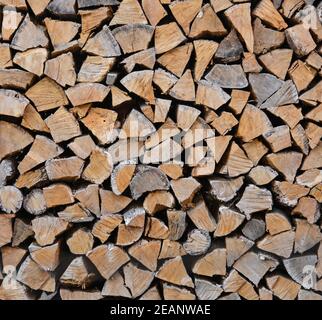 Stack pile of firewood oak wooden logs Stock Photo
