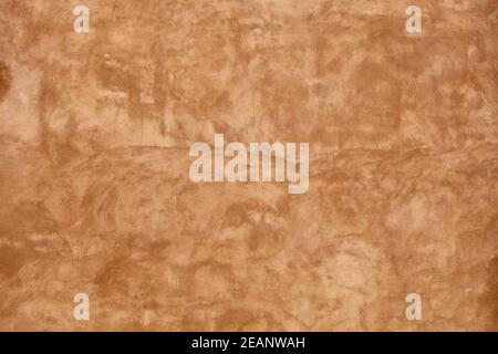 Grunge red painted plaster wall background Stock Photo