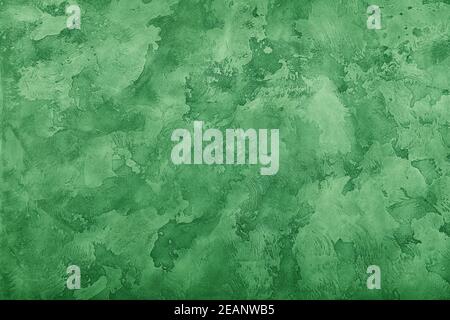 Grunge green painted plaster wall background Stock Photo