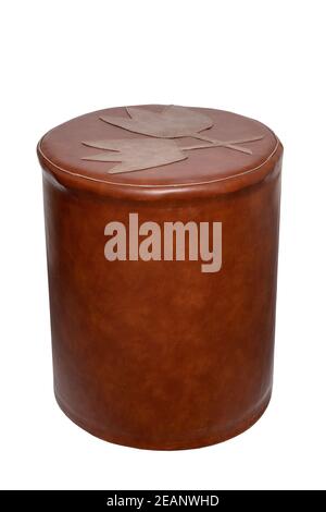 Vintage seating furniture. Stool with a red-brown leather covering from the middle of the last century isolated on a white background. Stock Photo