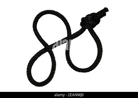 Rope isolated. Closeup of black rope with knot, isolated on a white background. Navy, marine and angler node. Stock Photo