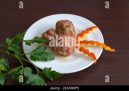 noisettes with parsley on a plate Stock Photo