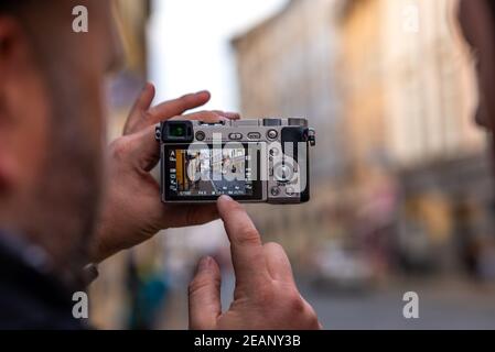 check the image on the digital camera display Stock Photo