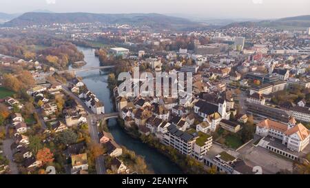 Drone view of cityscape Brugg north-east with Aare river, residential and commercial districts, historic old town and casino bridge in canton Aargau i Stock Photo