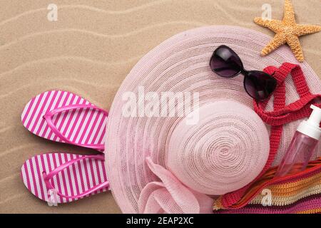 Accessories for the beach lying on the sand Stock Photo