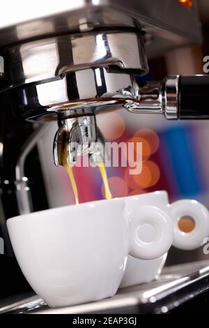 Close up of espresso machine filling two cups Stock Photo