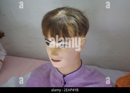 The head of a mannequin on a table Stock Photo