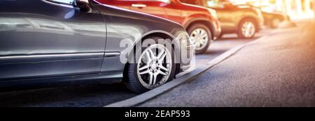Cars moving on the road in city in early morning Stock Photo