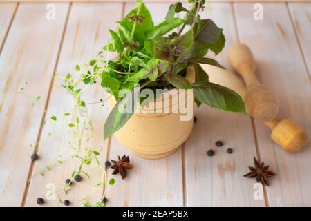 A mix of Italian herbs in a vase with cinnamon and seasonings. Stock Photo