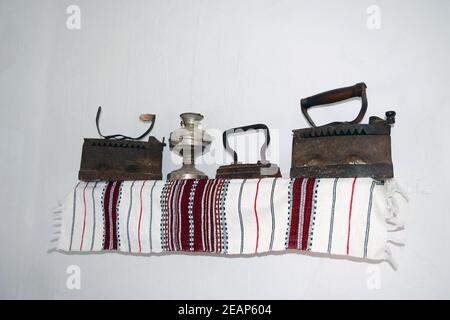 Ancient irons on a timber floor Stock Photo