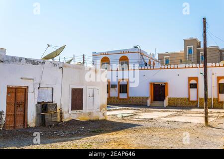 View of a narrow street of the Omani city Sur. Stock Photo