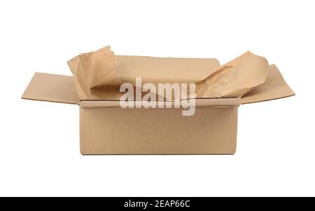 open cardboard rectangular box made of corrugated brown paper isolated on a white background Stock Photo