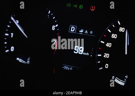 Speedometer in the car on the dashboard. The car's speedometer shows 99 mph Stock Photo