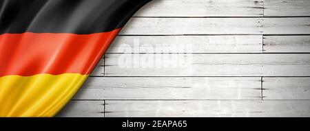 German flag on old white wall banner Stock Photo