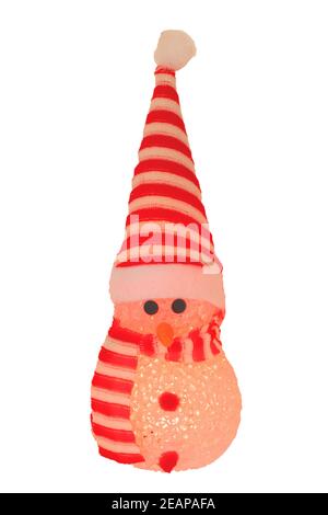 Christmas decoration isolated. Close-up of a yellow illuminated happy cute winter snowman with red white striped hat and scarf isolated on a white background. Macro photograph. Stock Photo