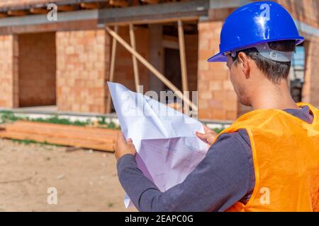 the construction manager inspects the project on the construction of a family house Stock Photo