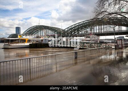 Cologne, Germany, February 4th. 2021, flood of the river Rhine, flooded landing stage, Hohenzollern bridge.  Koeln, Deutschland, 4. Februar 2021, Hoch Stock Photo