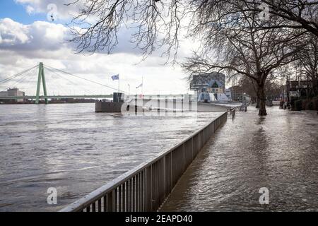 Cologne, Germany, February 4th. 2021, flood of the river Rhine, flooded promenade in the old part of the town, view to the Severins bridge and the Cho Stock Photo