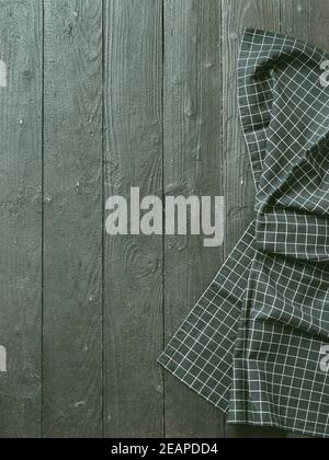 Gray wooden table with kitchen napkin, flat lay Stock Photo