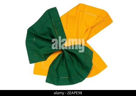 Top view of a folded yellow and a green kitchen cloth, textile, tablecloth or napkin isolated on a white background. Design element for your food product display montage. Stock Photo