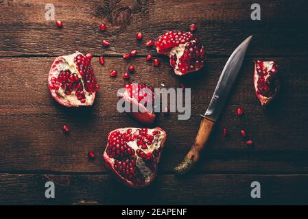 Pomegranate fruits with knife Stock Photo