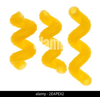 three single dried Cavatappi close up isolated Stock Photo