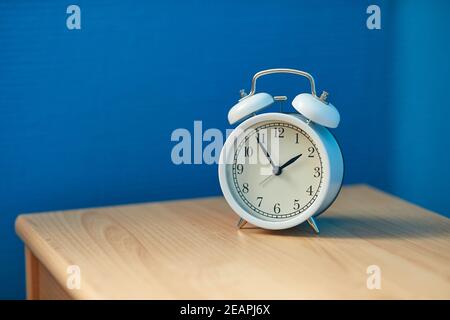 Alarm Clock on a Shelf Stock Photo