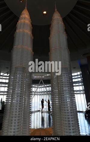 young couple taking pictures in the Observation Deck of the Petronas Twin Towers Stock Photo