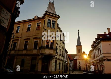 Medieval church at the end of a beautiful street in the historical center of Kosice in Slovakia at sunrise Stock Photo