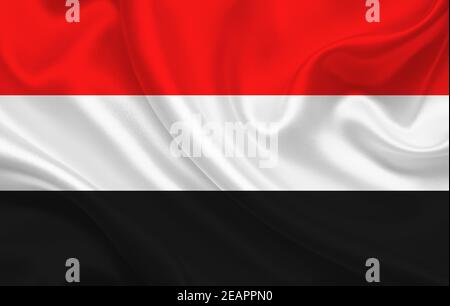 Yemen country flag on wavy silk fabric background panorama Stock Photo