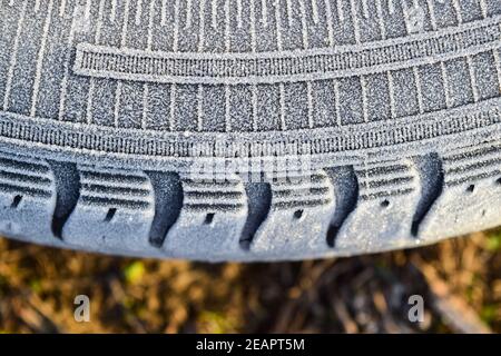 Hoarfrost on a rubber tire wheel Stock Photo