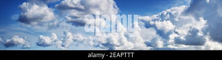 white fluffy clouds on blue sky in summer Stock Photo