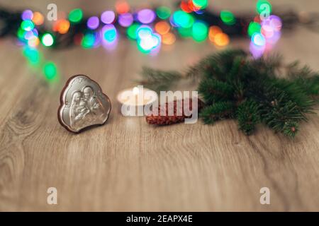 Christmas Composition of Church Icon on a Wooden Background With Multicolored Lights Stock Photo