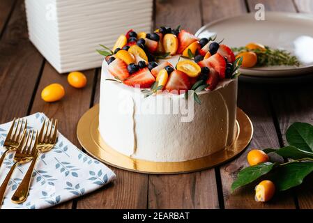 Light raspberry and blackberry wedding cake Stock Photo