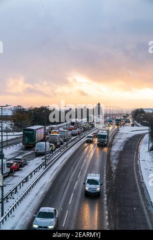 Traffic jam on two lanes after snow had fallen on a British dual