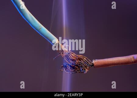 Closeup of electric wires with smoke photographed in the studio Stock Photo