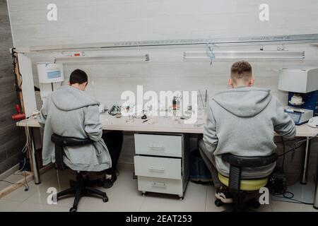 Dental Technician Working On A 3D Printed Mold For Tooth Implants In The Lab Stock Photo