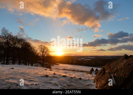 Leicester, Leicestershire, UK 10th Feb 2021. UK Weather. Snow. Sunset on a snowy day at Bradgate Park in Leicestershire. Alex Hannam/Alamy Live News