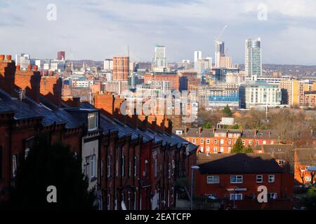 A view across Leeds City Centre from a row of back to back terraced houses in Beeston. Stock Photo