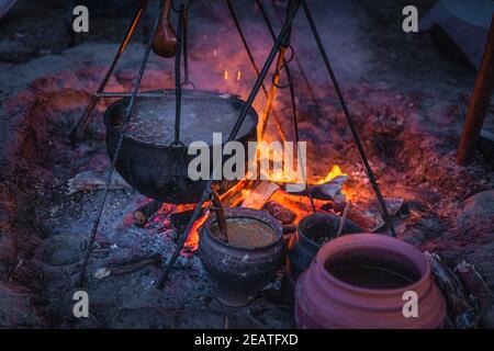 Boiling cauldron with mysterious decoction at Kupala Night Stock Photo