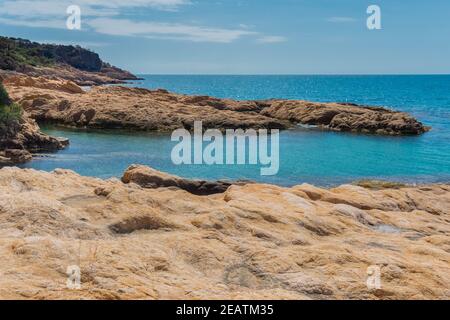 Rocky beach landscape of Costa Brava. Extraordinary rock formations in turquoise sea.Lloret de Mar. Catalonia. Spain.